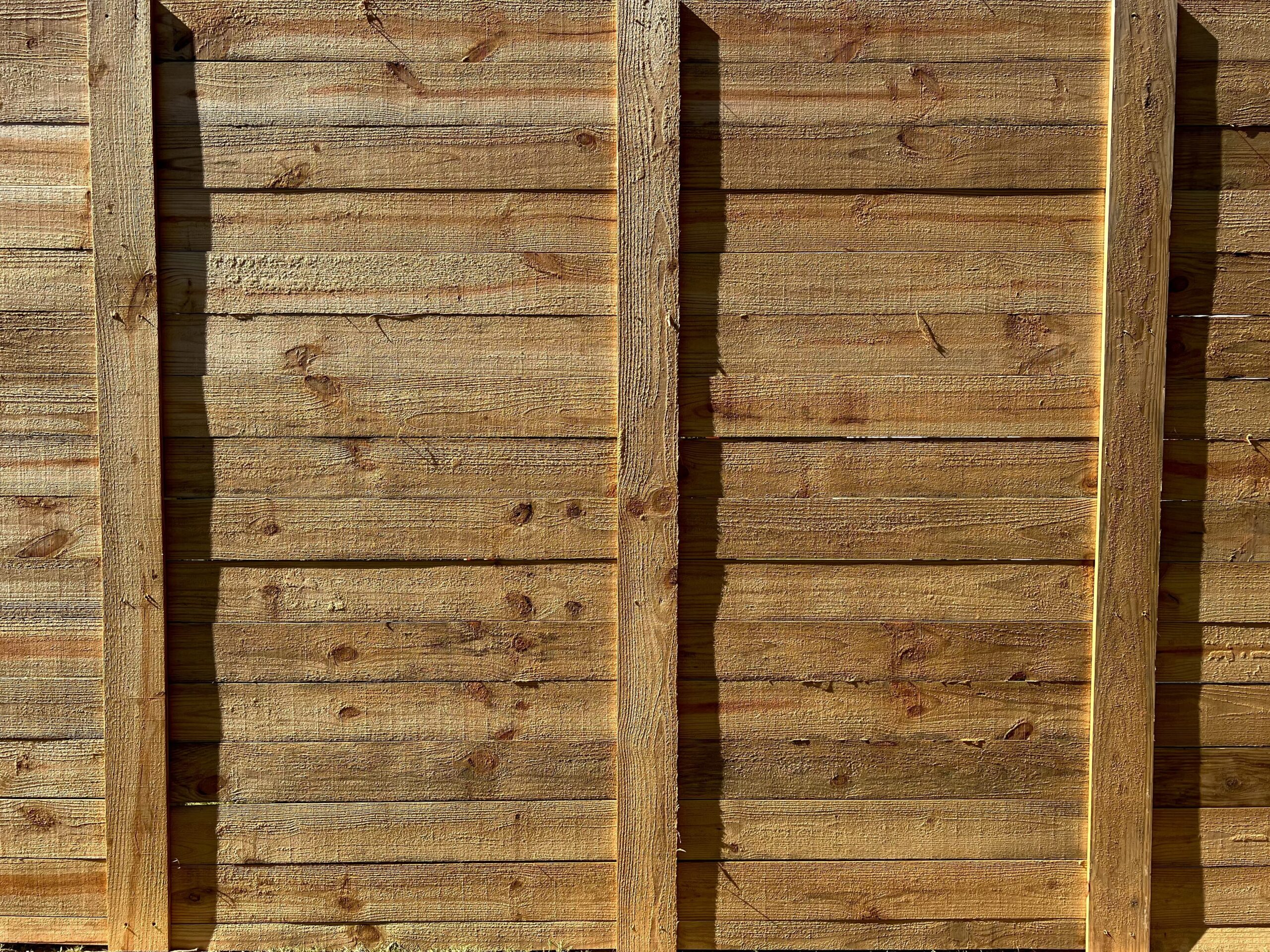 Horizontal wood picket fence.