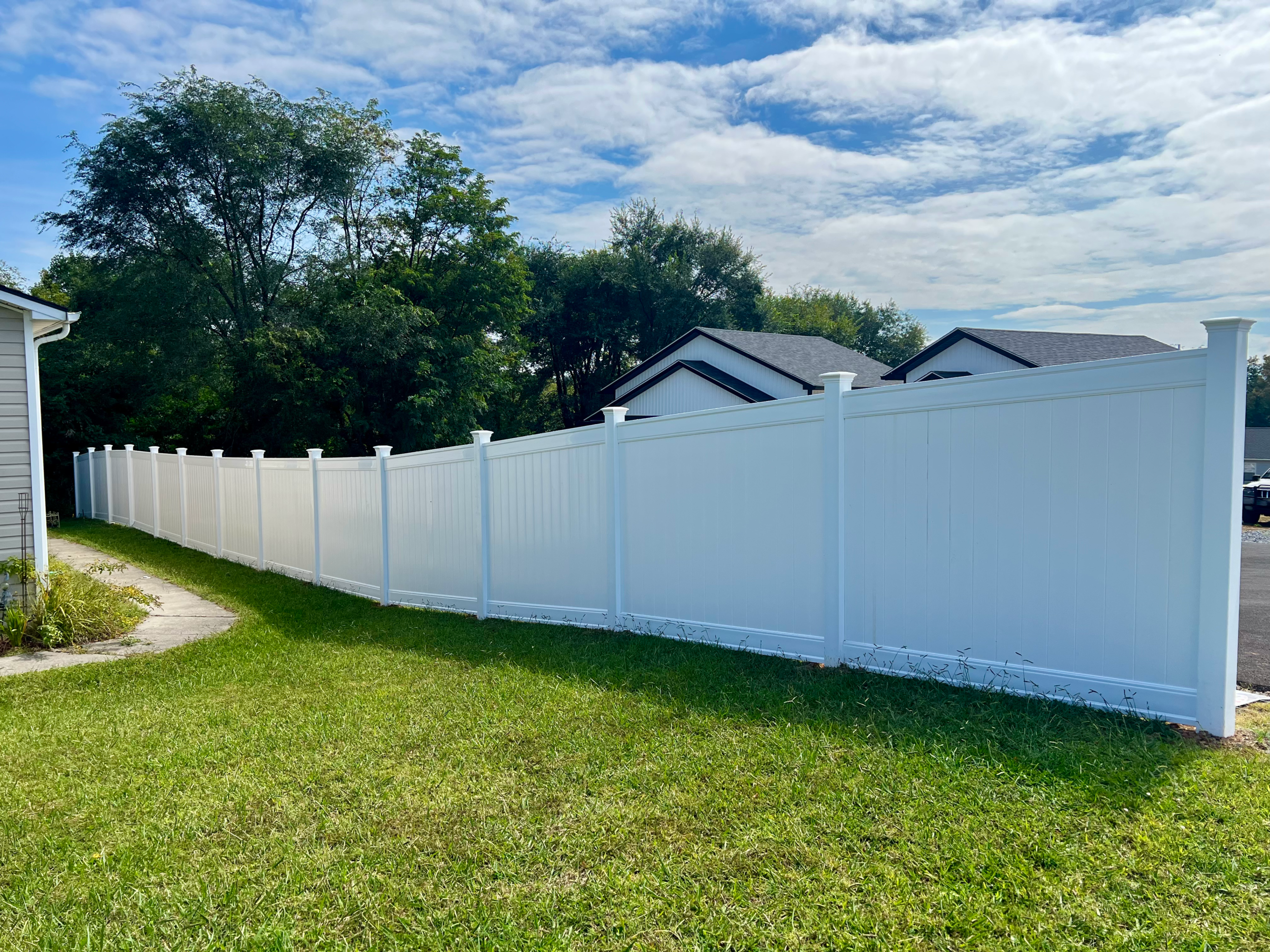 Vinyl privacy fencing.